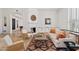 Bright living room features a fireplace, comfortable seating, and large windows at 8575 E Sharon Dr, Scottsdale, AZ 85260