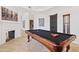 Game room with a pool table, fireplace, and artwork at 8575 E Sharon Dr, Scottsdale, AZ 85260