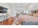 Main bedroom with hardwood floors, sitting area, and en-suite bathroom at 8575 E Sharon Dr, Scottsdale, AZ 85260