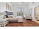 Spacious bedroom with king-size bed, daybed, and hardwood floors at 8575 E Sharon Dr, Scottsdale, AZ 85260
