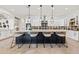 Modern kitchen with large island and stylish bar stools at 8575 E Sharon Dr, Scottsdale, AZ 85260