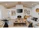 Spacious living room features a fireplace, high ceilings, and comfortable seating at 8575 E Sharon Dr, Scottsdale, AZ 85260