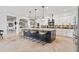 Modern kitchen with large island, stainless steel appliances, and stylish backsplash at 8575 E Sharon Dr, Scottsdale, AZ 85260