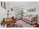 Charming bedroom with a daybed, workspace, and fireplace at 8575 E Sharon Dr, Scottsdale, AZ 85260
