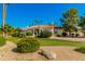 Stunning home exterior featuring mature landscaping and a grand entrance at 8575 E Sharon Dr, Scottsdale, AZ 85260