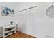 White built-in closet with mirrored doors and wood floors at 8575 E Sharon Dr, Scottsdale, AZ 85260