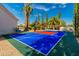 Private backyard sport court with basketball and tennis at 8575 E Sharon Dr, Scottsdale, AZ 85260