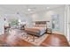 Large main bedroom with hardwood floors and sitting area at 8575 E Sharon Dr, Scottsdale, AZ 85260