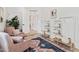 Sitting area with armchairs, storage shelving, and area rug at 8575 E Sharon Dr, Scottsdale, AZ 85260