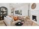 Spacious living area with a fireplace and access to backyard at 8575 E Sharon Dr, Scottsdale, AZ 85260