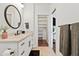 Clean bathroom with vanity, and access to a linen closet at 8575 E Sharon Dr, Scottsdale, AZ 85260