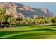 Golf course with mountain views and lush landscaping at 7501 E Golden Eagle Cir # 27, Gold Canyon, AZ 85118