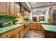 Bright kitchen with wood cabinets, green tile backsplash and stainless steel appliances at 7501 E Golden Eagle Cir # 27, Gold Canyon, AZ 85118