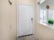 Front entry with modern door and neutral color scheme at 13165 W Ventura St, Surprise, AZ 85379