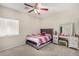 Well-lit bedroom featuring a vanity and a comfortable bed at 13165 W Ventura St, Surprise, AZ 85379