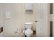 Small, clean bathroom with a toilet and a pedestal sink at 13165 W Ventura St, Surprise, AZ 85379