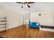Bonus room with hardwood floors and built-in shelving at 13165 W Ventura St, Surprise, AZ 85379