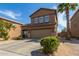Two-story home with a two-car garage and desert landscaping at 13165 W Ventura St, Surprise, AZ 85379