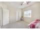 Charming bedroom with plush carpet, a ceiling fan, and ample closet space at 13165 W Ventura St, Surprise, AZ 85379