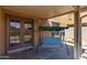 Covered patio with striped swing and access to backyard at 13165 W Ventura St, Surprise, AZ 85379