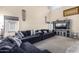 Spacious living room with sectional sofa and built-in entertainment center at 13165 W Ventura St, Surprise, AZ 85379
