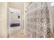 Bathroom with shower and view into bedroom at 13165 W Ventura St, Surprise, AZ 85379