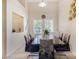 Bright dining room with a modern table and six chairs at 13165 W Ventura St, Surprise, AZ 85379