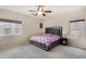 Main bedroom with carpeted floors, a ceiling fan, and plenty of natural light at 13165 W Ventura St, Surprise, AZ 85379