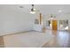 Bright living room with tile floors and ceiling fans at 6112 S 195Th Dr, Buckeye, AZ 85326