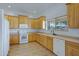 Bright kitchen with wood cabinets and tile floors at 6112 S 195Th Dr, Buckeye, AZ 85326