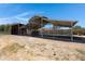 Covered and uncovered horse stables providing shelter and space for equine care at 6112 S 195Th Dr, Buckeye, AZ 85326