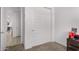 Hallway with view into living room and sliding doors to closet at 18767 W Canterbury Dr, Surprise, AZ 85388