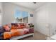 Serene bedroom with daybed, window, and closet at 18767 W Canterbury Dr, Surprise, AZ 85388