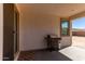 Covered patio with built-in grill and access to backyard at 18767 W Canterbury Dr, Surprise, AZ 85388