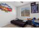 Cozy bedroom featuring a twin bed and desk area at 18767 W Canterbury Dr, Surprise, AZ 85388