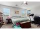 Bedroom with a queen bed, dresser, and treadmill at 18767 W Canterbury Dr, Surprise, AZ 85388
