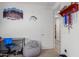 Bright bedroom with desk, beanbag chair, and closet at 18767 W Canterbury Dr, Surprise, AZ 85388