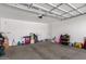 Spacious garage with overhead storage and ample space at 18767 W Canterbury Dr, Surprise, AZ 85388