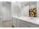 Double vanity bathroom with sunflower shower curtain at 18767 W Canterbury Dr, Surprise, AZ 85388