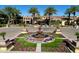 Community clubhouse with fountain and manicured landscaping at 247 E Las Puertas Ln, San Tan Valley, AZ 85140