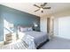 Bedroom with large windows, ceiling fan and ensuite bathroom at 247 E Las Puertas Ln, San Tan Valley, AZ 85140