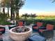 Outdoor fire pit with seating area and golf course view at 247 E Las Puertas Ln, San Tan Valley, AZ 85140