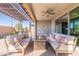 Outdoor patio with seating area and pergola, ideal for relaxing and entertaining at 247 E Las Puertas Ln, San Tan Valley, AZ 85140