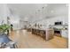 Modern kitchen open to living area with large island and stainless steel appliances at 13789 E Geronimo Rd, Scottsdale, AZ 85259