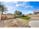 Landscaped backyard with artificial turf and rock features at 13789 E Geronimo Rd, Scottsdale, AZ 85259