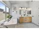 Spa-like bathroom with double vanity, free-standing tub, and large window at 13789 E Geronimo Rd, Scottsdale, AZ 85259