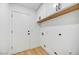 Laundry room with upper cabinets and wood flooring at 13789 E Geronimo Rd, Scottsdale, AZ 85259