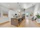 Modern kitchen with island, stainless steel appliances, and light wood flooring at 13789 E Geronimo Rd, Scottsdale, AZ 85259