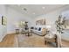 Open concept living room with light walls, comfortable seating, and large windows at 13789 E Geronimo Rd, Scottsdale, AZ 85259