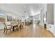 Open concept dining area with modern light fixtures and hardwood floors at 13789 E Geronimo Rd, Scottsdale, AZ 85259